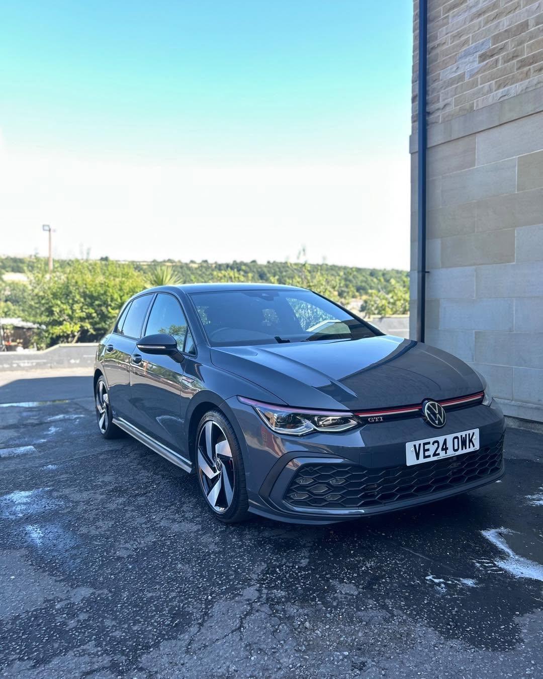 Blue Volkswagen Golf outside a customer’s home